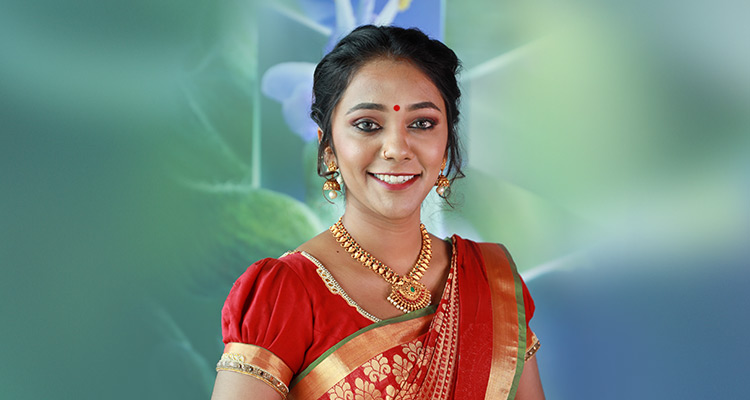Woman wearing makeup for Deepavali 2021 